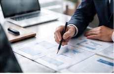 Business professional reviewing investment documents